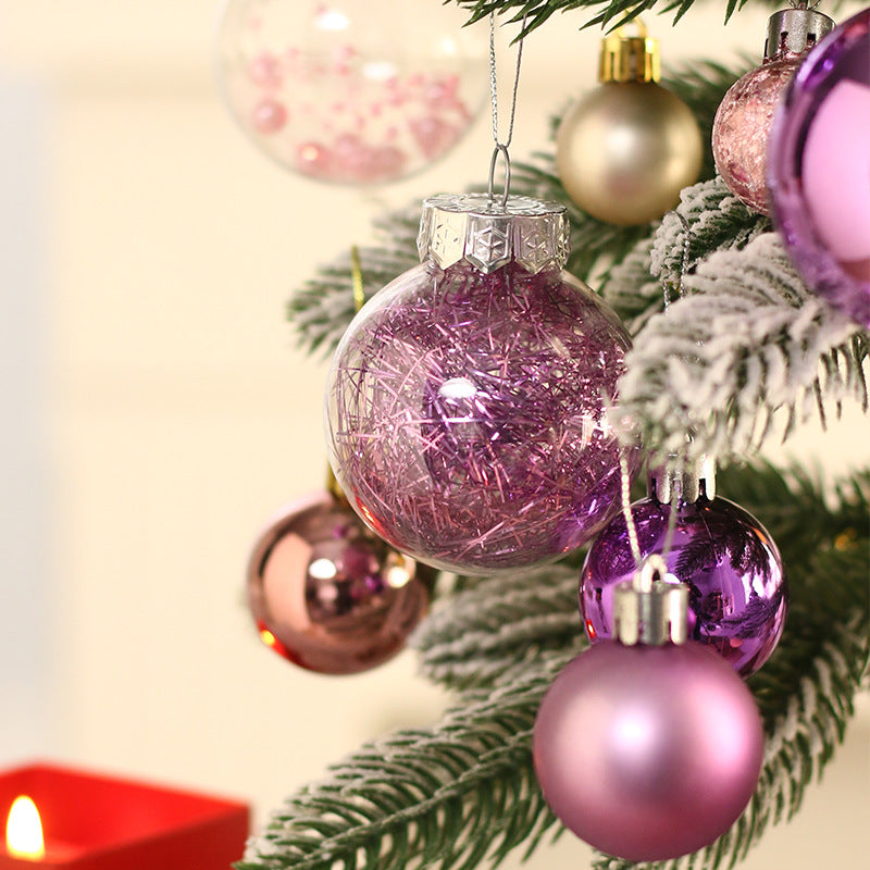 A miniature LED Christmas Tree Decoration Featuring White Flocking Cedar Tree with Purple Ornaments, and a Set of Holiday Tabletop Ornaments